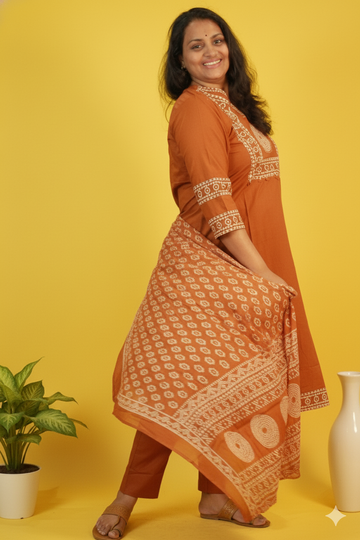 Bindhu effortless grace in brown bandhini suit set